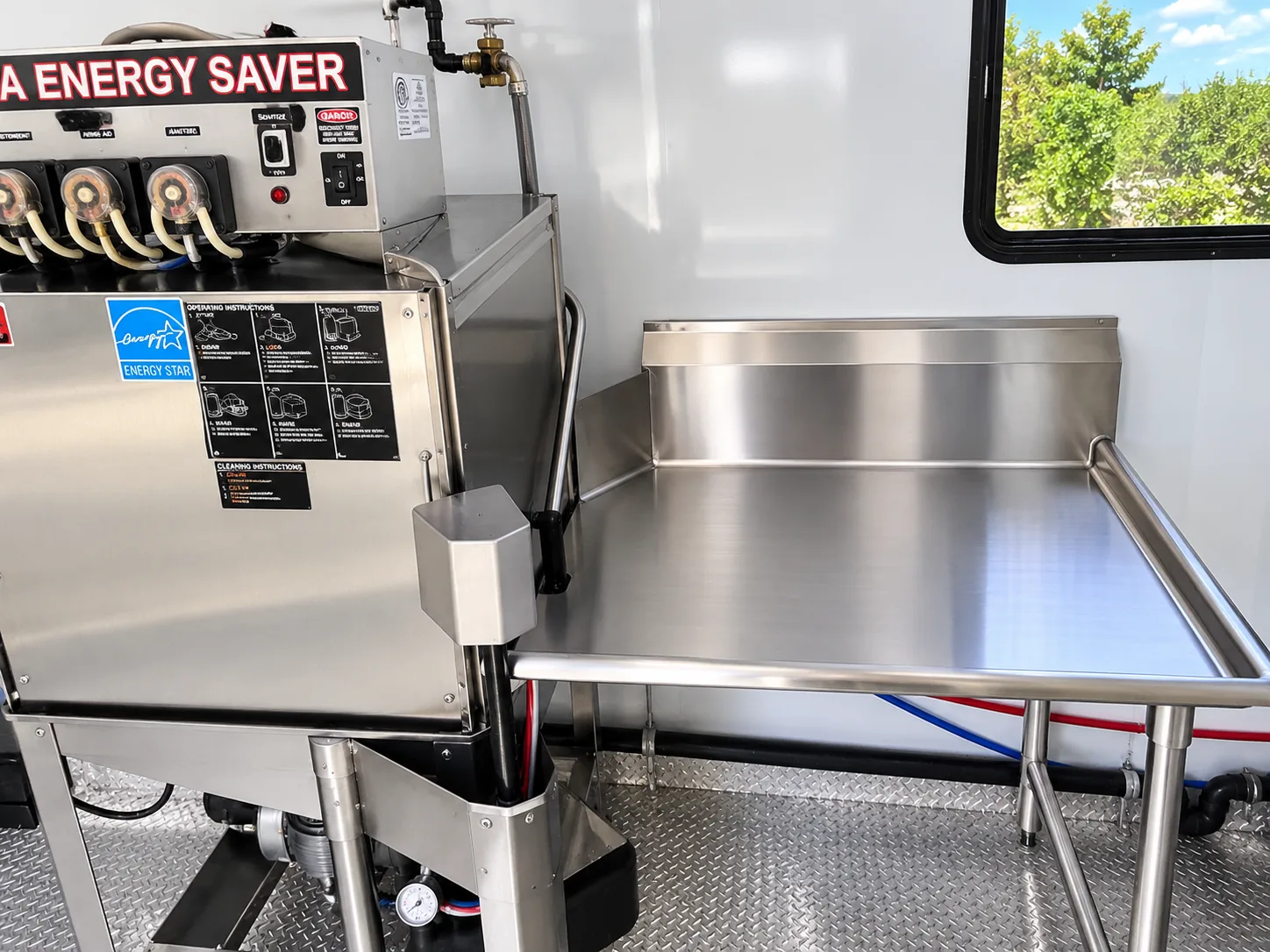 Commercial dishwashing machine installed in a mobile trailer
