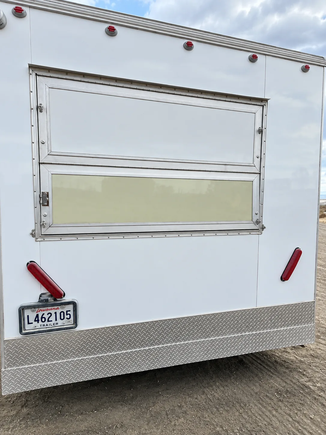 Exterior service window on a mobile commercial kitchen trailer
