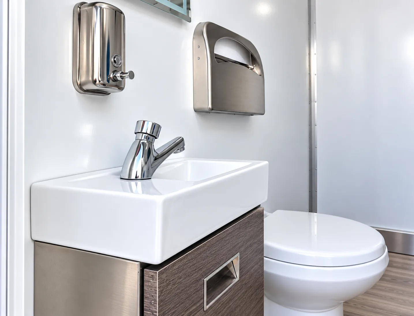 Commercial sink area inside a mobile restroom trailer